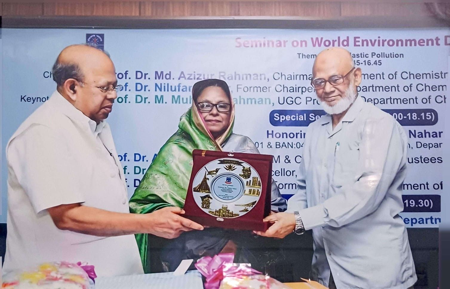 Dr. Nilufar Nahar being presented with a commemorative crest at a seminar marking World Environment Day